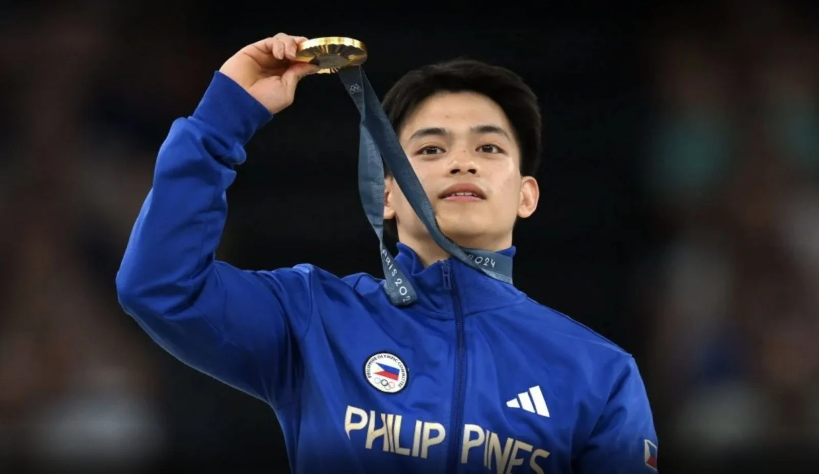 ABOVE Carlos Edriel Yulo of Team Philippines with his gold medal after the Men's Floor Exercise Final at the Gymnastics Bercy Arena (Photo By Stephen McCarthy / Sportsfile via Getty Images)